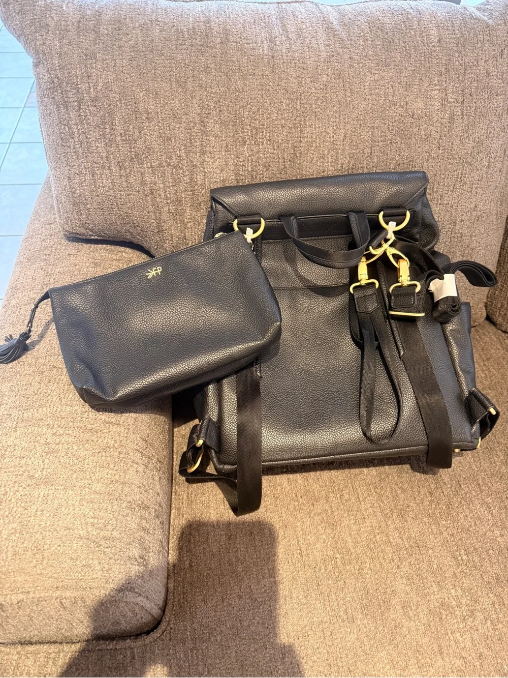 FP Black Leather Fold-Top Backpack with Gold Accents